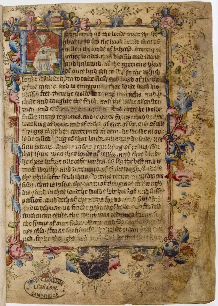 An old manuscript page with intricate floral designs and colourful illustrations at the edges