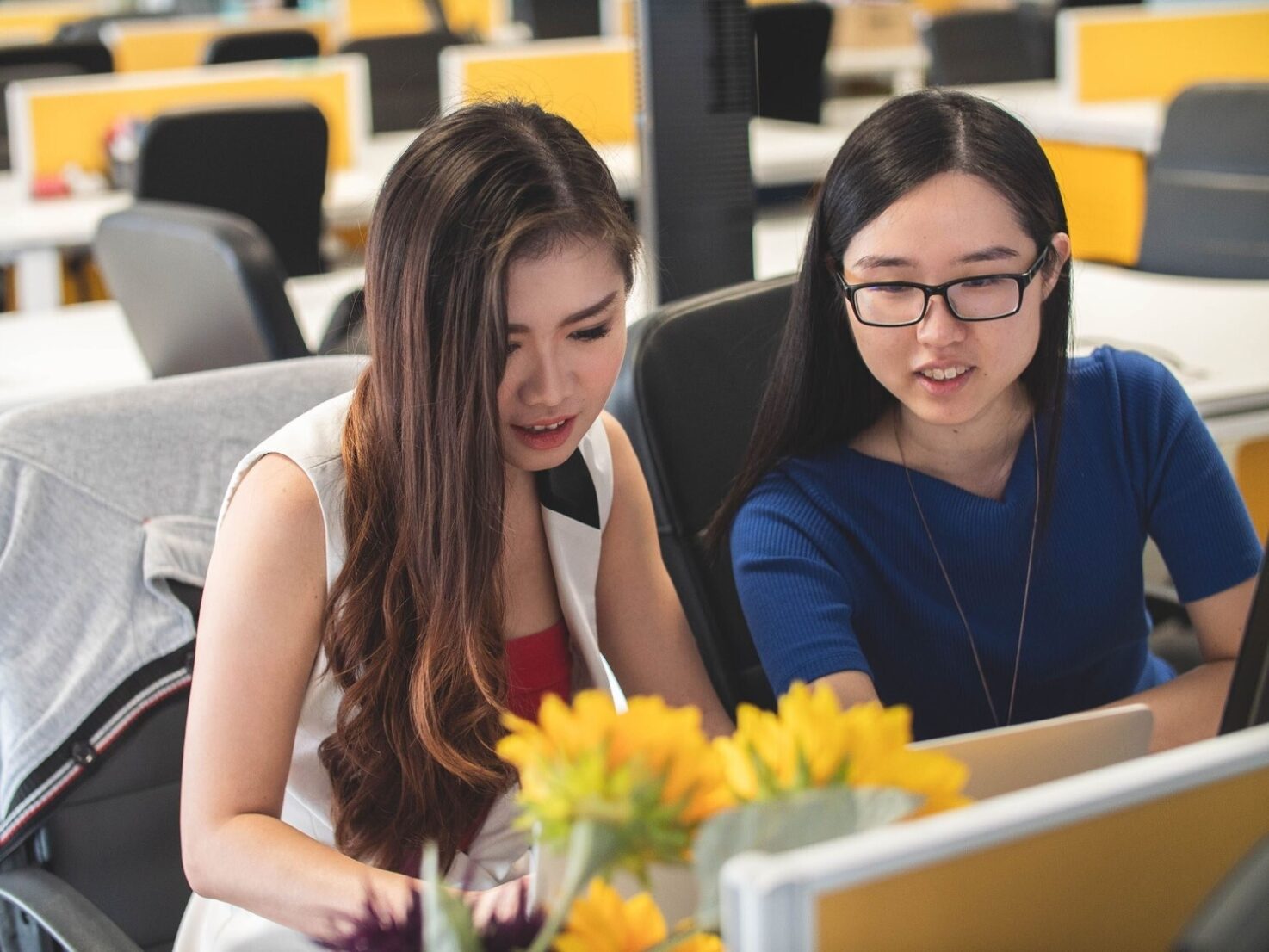 Two students around a computer