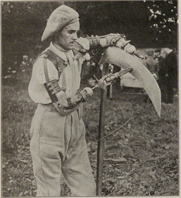 A man in historical clothing uses a large mechanical hand to hold a curved tool outdoors.