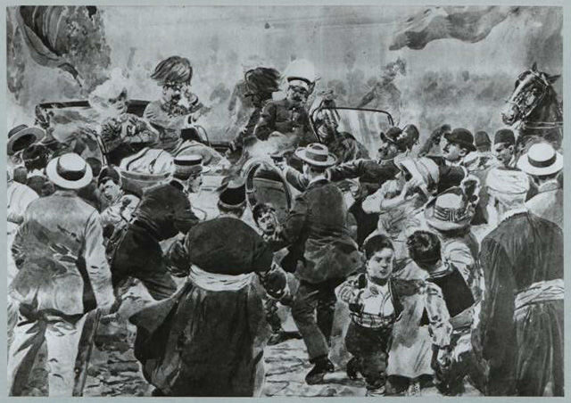 A chaotic crowd surrounds a car with a military officer, people reaching out to him.