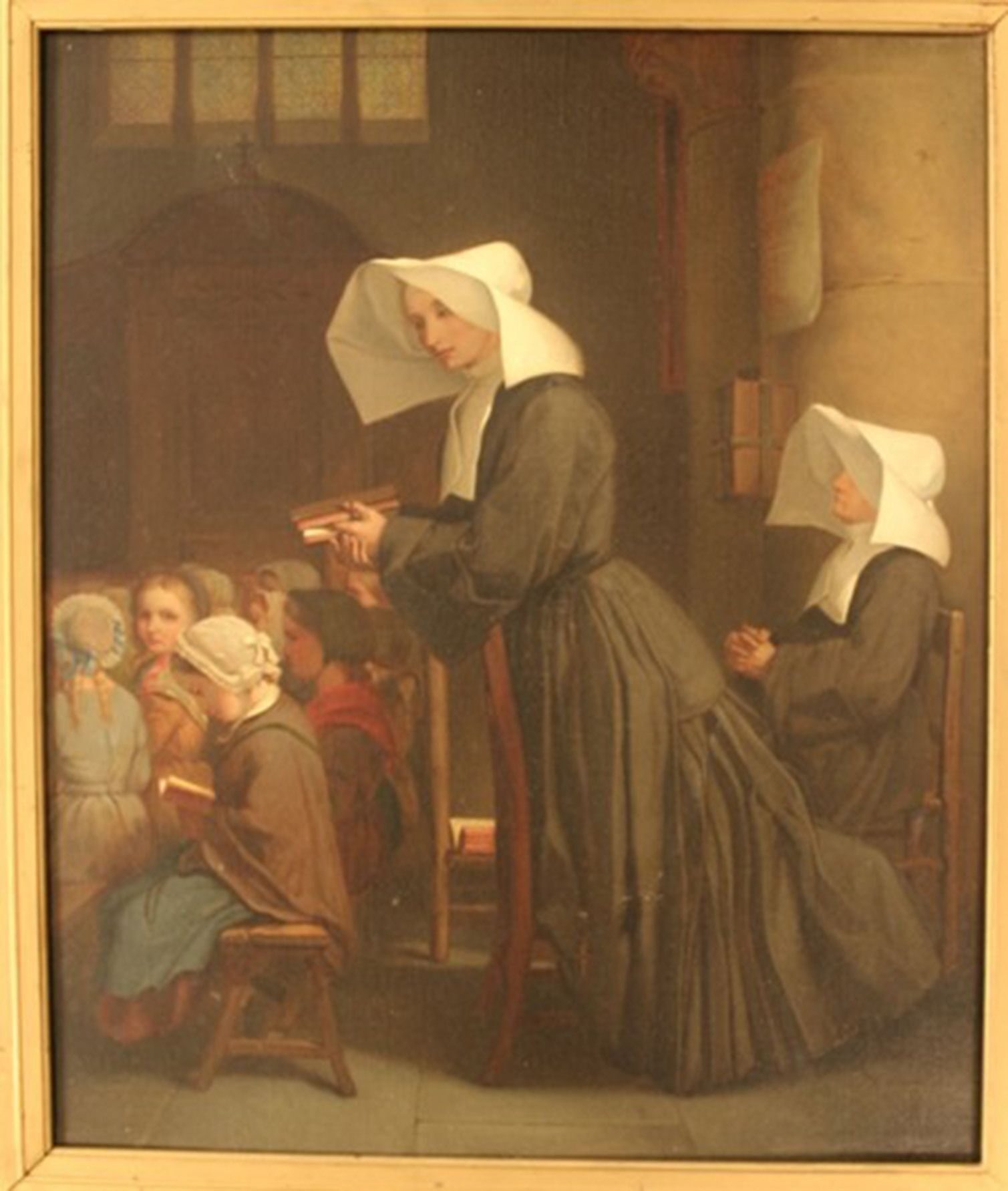 A classroom scene with children sitting and reading, while a teacher stands. Two women in traditional cloaks supervise.