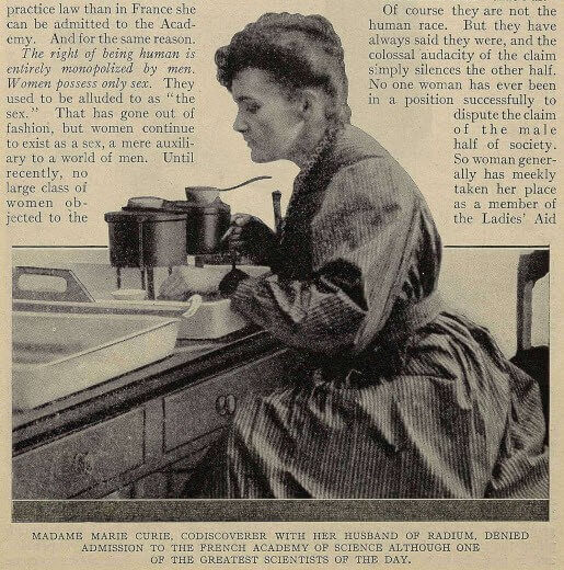 Marie Curie, wearing a dark dress, working at a table with scientific equipment.