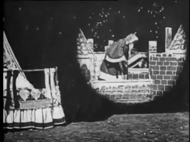 A black and white film scene showing Santa Claus entering a brick chimney with snowfall.