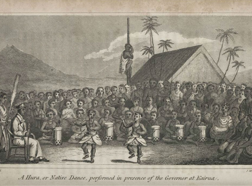 A traditional dance performance in front of a crowd, featuring drummers and a dancer in costume.