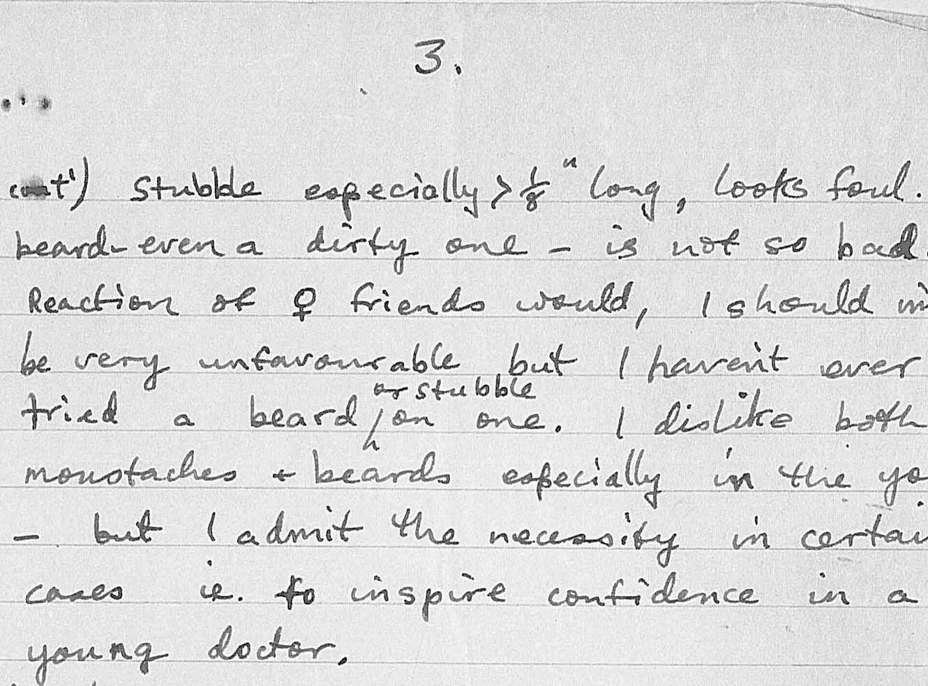 A handwritten note discussing opinions on facial hair, particularly beards and stubble.