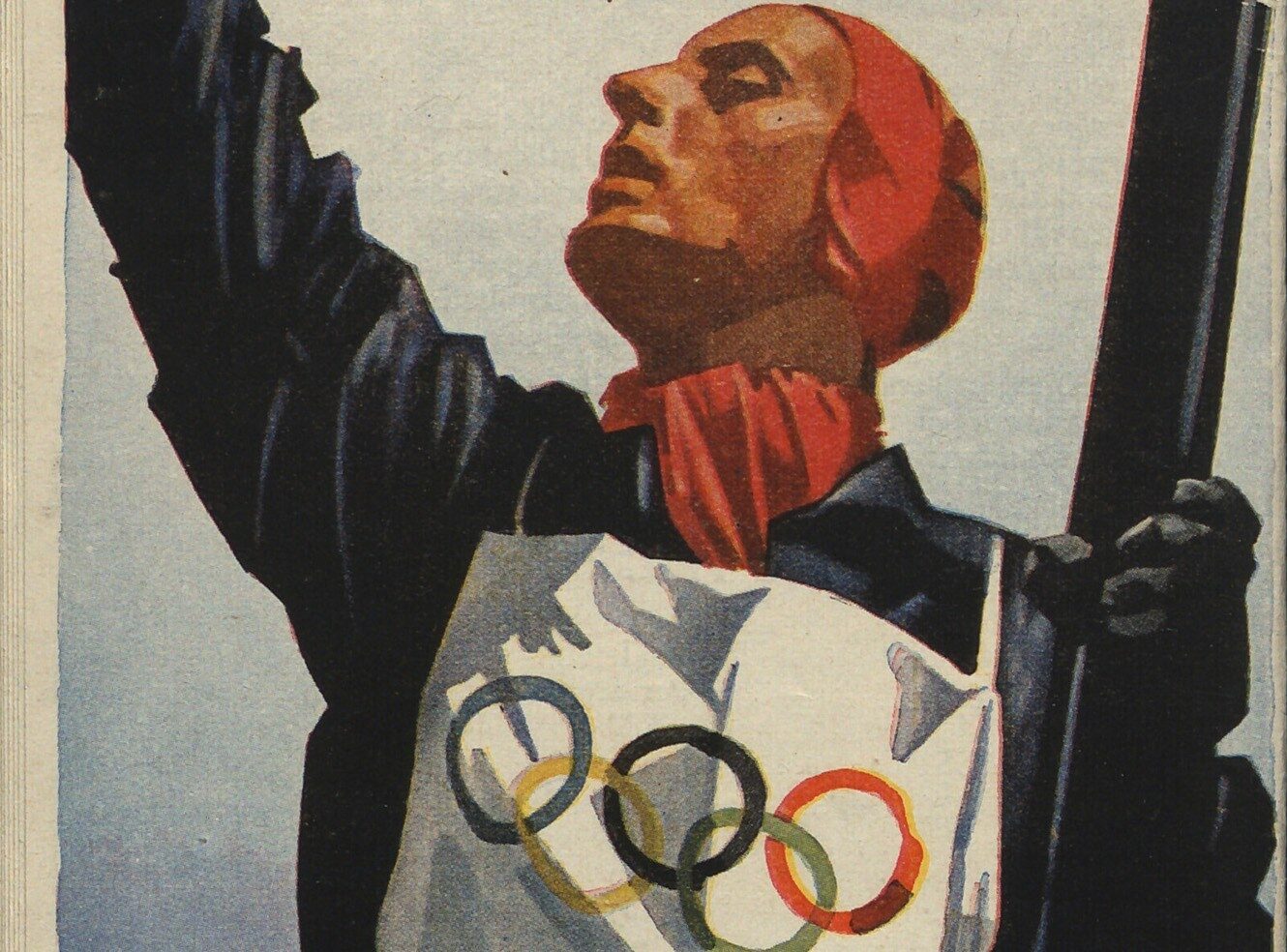 A man in a black outfit and red scarf holds a flag with Olympic rings.