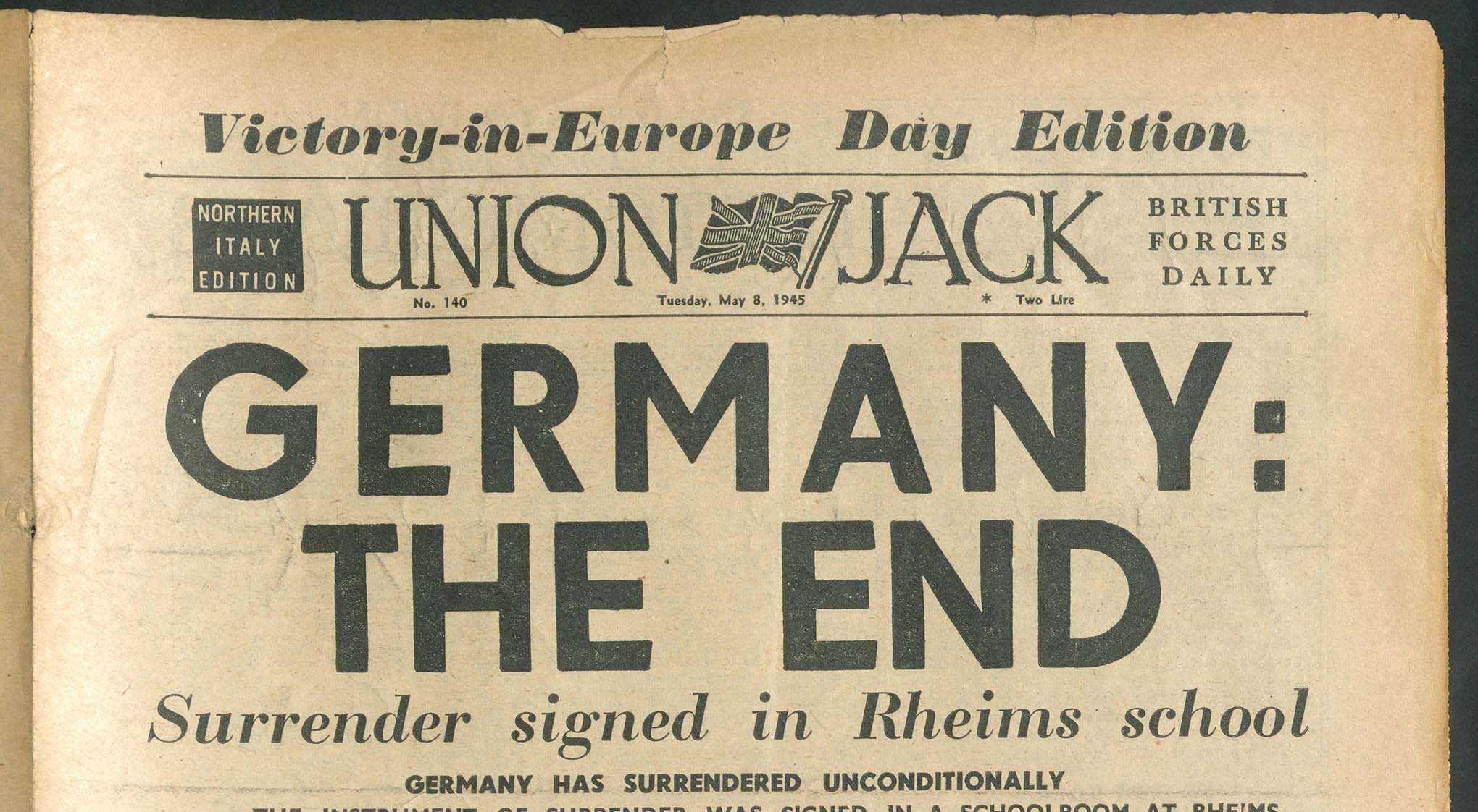 Newspaper headline announcing Germany's unconditional surrender on VE-Day, May 8, 1945.
